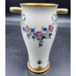 A William Moorcroft for Macintyre Burslem vase with floral garlands and rosettes. 19cms. Stamped