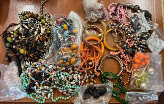 A quantity of vintage beads and bangles.