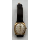 A gentleman’s Tissot Antimagnetique 9 carat gold cased wristwatch with subsidiary seconds dial.