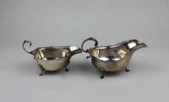 Two similar George V silver sauce boats with flying scroll handles, Birmingham and Chester 1929, 7.