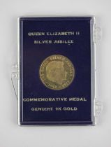 A 9ct gold Queen Elizabeth II Silver Jubilee medallion 3.1g