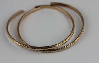 Two similar yellow metal bangles, unmarked, 28.7g