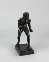 A bronze figure of a boxer, unsigned, on rectangular base 20.5cm high