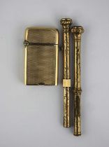 A gold cased lighter detailed indistinctly ‘9ct’, the exterior engine turned gross weight 45g and
