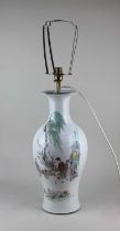 A Chinese porcelain baluster vase converted to a table lamp, decorated with figures and Chinese