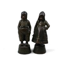 A pair of bronze figures of a Dutch boy and girl 14cm high