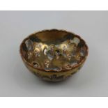 A Japanese Satsuma ware bowl with figural decoration and git embellishments, mark to base 21.5cm