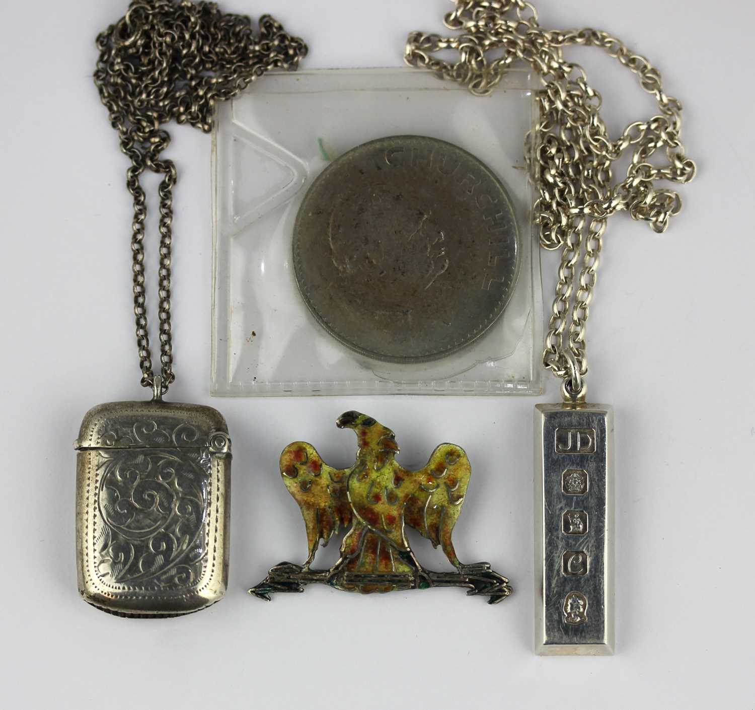A silver vesta case with engraved decoration, Birmingham 1910, with a silver neck chain, a silver