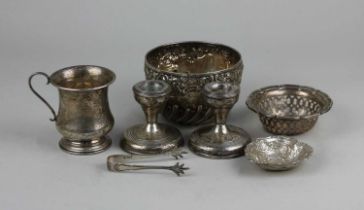 A Victorian silver circular sugar bowl with embossed floral border and demi reeding, a George V