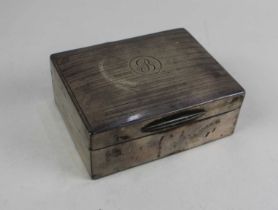 A silver cigarette box with an engine turned lid and initial B 11.5cm (a/f - marks rubbed)