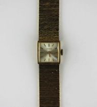 A Longines 9ct gold ladies bracelet wristwatch, the signed silvered dial with gilt baton hour