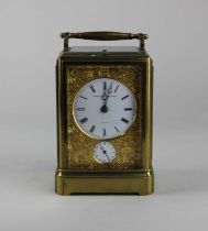 A 19th Century Aubert & Klaftenberger Geneve gilt brass repeater carriage clock with alarm, circular