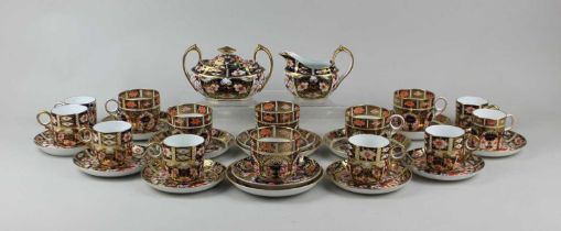 A Royal Crown Derby Imari porcelain matched part coffee service to include sugar bowl and cover,