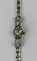 A Girard Perregaux white gold and diamond ladies bracelet wristwatch with a signed circular jewelled