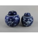 Two Chinese blue and white porcelain ginger jars with covers both decorated with the prunus pattern,