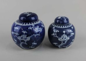 Two Chinese blue and white porcelain ginger jars with covers both decorated with the prunus pattern,