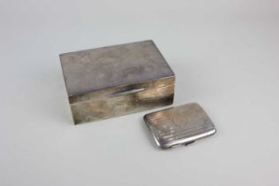 A modern silver rectangular cigarette box with presentation engraving, maker Garrard & Co, London