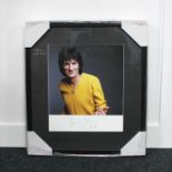 A framed autographed colour photograph of Ronnie Wood, The Rolling Stones, signed and dated 2015