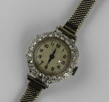 A ladies diamond set circular cased dress wristwatch the circular jewelled movement detailed '