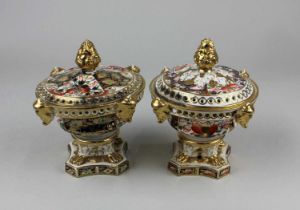 A pair of Royal Crown Derby porcelain Imari pot pourris and covers 15.5cm high (a/f - repairs)
