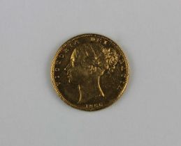 A Victorian gold sovereign with shield back dated 1856