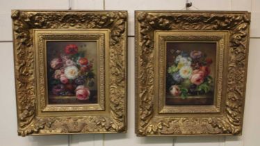 F Suzan, a pair of still life paintings depicting roses, primroses and other flowers in vases, oil