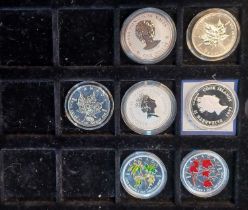 A collection of twenty four silver commemorative coins to include The Australian Kookaburra, Chinese