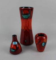 Three Poole pottery Peacock pattern vases, to include two with boxes, 24.5cm high