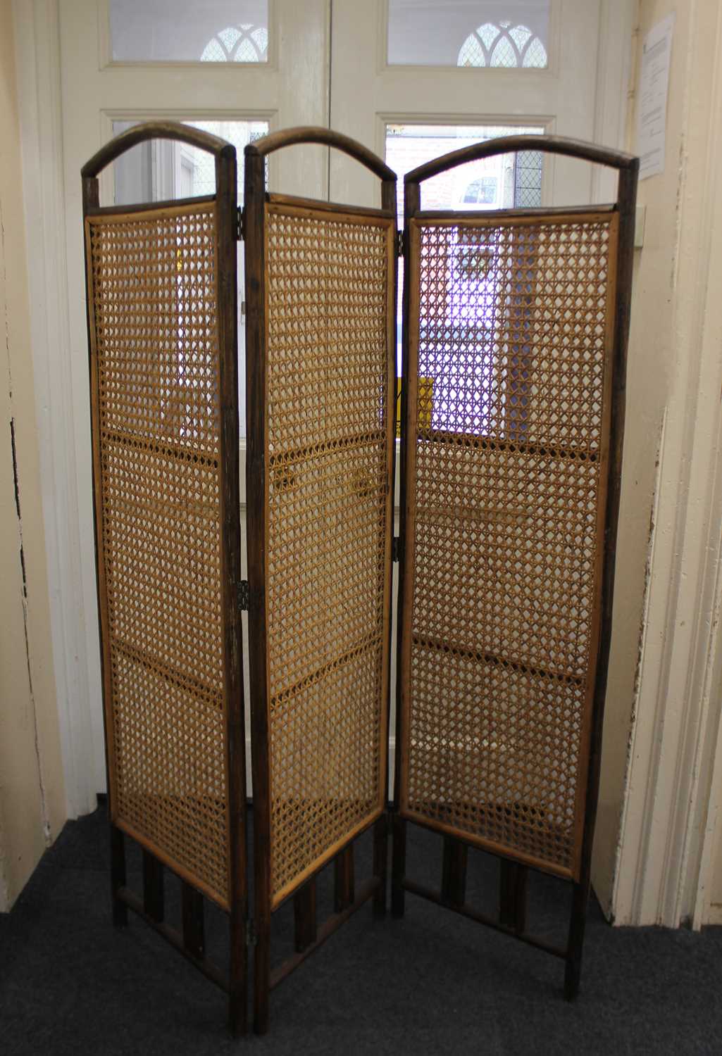 A three-fold room screen with rattan inset panels each panel 165cm by 47cm (a/f)