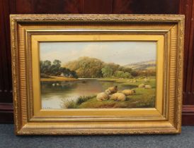 J C Morris, a pair of river landscapes with sheep and watering cattle, both signed, 29cm by 49cm