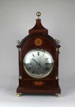 A late 19th century mahogany inlaid bracket clock, the circular silvered dial with Roman numerals,