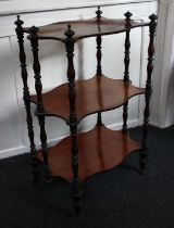 A Victorian mahogany three-tier whatnot serpentine form on turned supports with finials, 57cm