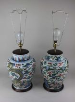 Two similar Chinese famille verte porcelain vase table lamps decorated with dragons and clouds,
