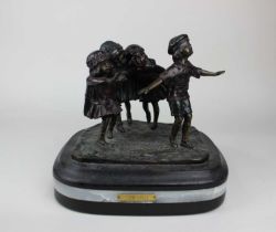 After D H Chiparus, a bronze figure group of children playing, on rectangular stone base with