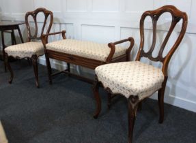 A duet piano stool with hinged seat 99cm and a pair of Victorian dining chairs with matching