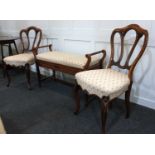 A duet piano stool with hinged seat 99cm and a pair of Victorian dining chairs with matching