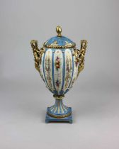 A Rudolstadt porcelain two handled vase and cover, the lobed ovoid body decorated with fruit and