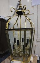 A modern Regency style brass framed eight light ceiling lantern, with bevelled glass panels approx