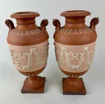 A pair of 19th century three-tone terracotta urns in the neoclassical taste attributed to