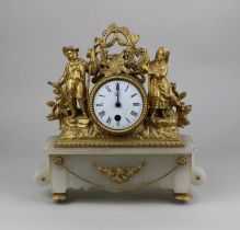 A French gilt metal figural mantle clock, the drum shaped case enclosing enamel dial with Roman