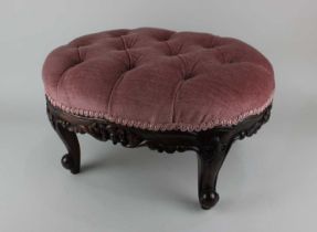 A button upholstered oval footstool on carved cabriole legs, 47cm