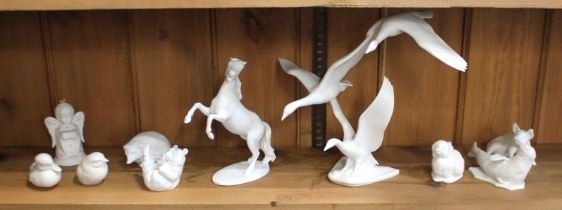 A collection of Kaiser porcelain white matte animals to include swans, farm animals and others,