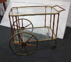 A brass tea trolley two glass shelves with bamboo supports, 75cm