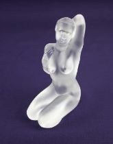 A Lalique model of a kneeling nude figure 'Aphrodite' engraved Lalique France to base 12cm high,