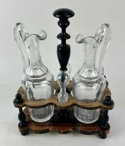 A 19th century French oil and vinegar cruet set the two facet cut clear glass ewers with stoppers,