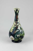 A large Moorcroft pottery vase in the 'Lamia' pattern of baluster form with a flared rim,