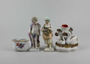 A pair of KPM porcelain figures, a small Staffordshire pottery spill vase decorated with two