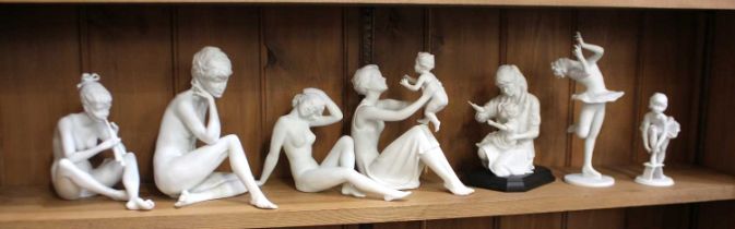 A collection of Kaiser porcelain white matte figurines to include three nudes, two mother with child