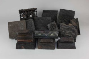 A collection of carved wood printing blocks, various designs