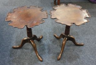 A pair of mahogany side tables with circular fret cut tops on tripod bases, 41cm